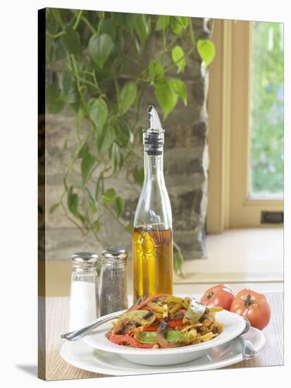 Flavored Oil and Salt and Pepper Shakers Beside Bowl of Pasta-null-Stretched Canvas