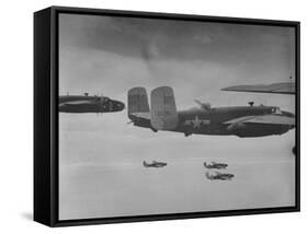 Flight of American B-25 Mitchell Bombers Enroute to a Bombing Mission over the Port of Madang-Myron Davis-Framed Stretched Canvas