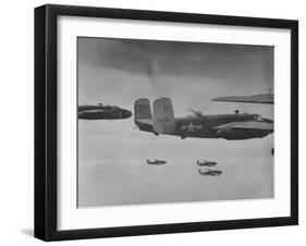 Flight of American B-25 Mitchell Bombers Enroute to a Bombing Mission over the Port of Madang-Myron Davis-Framed Photographic Print