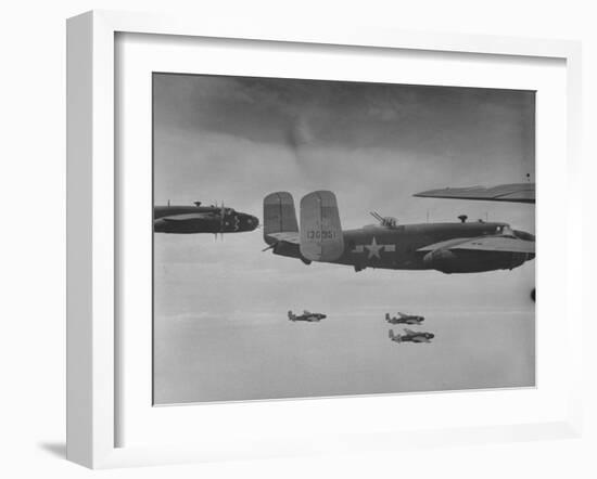 Flight of American B-25 Mitchell Bombers Enroute to a Bombing Mission over the Port of Madang-Myron Davis-Framed Photographic Print