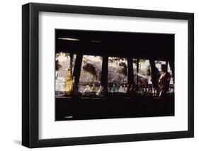 Floating-Home Owner Warren Owen Fonslor Watering the Hanging Plants, Sausalito, CA, 1971-Michael Rougier-Framed Photographic Print