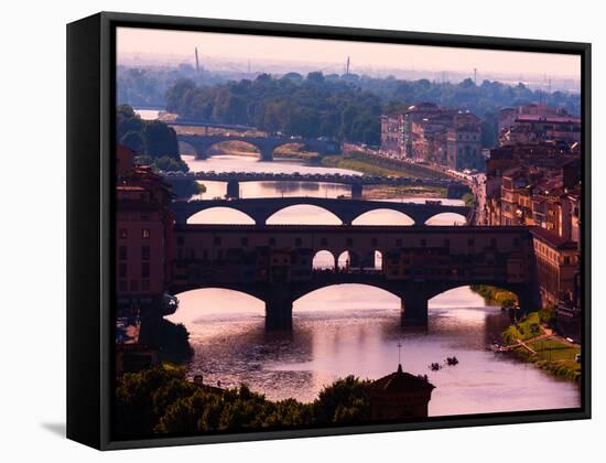 Florence, Florence Province, Tuscany, Italy. View to bridges across Arno river. Ponte Vecchio in...-null-Framed Stretched Canvas