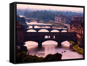 Florence, Florence Province, Tuscany, Italy. View to bridges across Arno river. Ponte Vecchio in...-null-Framed Stretched Canvas