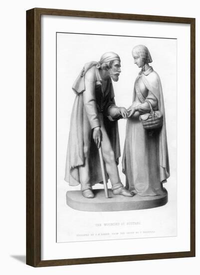 Florence Nightingale (1820-191) Tending to a Wounded Man at Scutari, Turkey, 19th Century-JH Baker-Framed Giclee Print