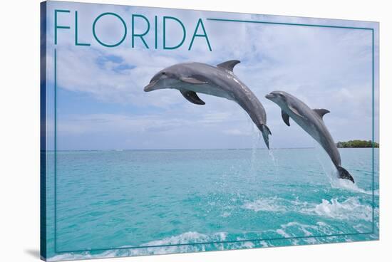 Florida - Jumping Dolphins-Lantern Press-Stretched Canvas