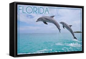 Florida - Jumping Dolphins-Lantern Press-Framed Stretched Canvas