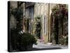 Flower Bedecked Street, St. Cyprien, Dordogne, France, Europe-Peter Richardson-Stretched Canvas