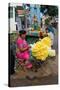 Flower Garland Maker and Seller Sitting under Durga Devi Temple Arch in Vidyaranyapura,…-null-Stretched Canvas