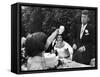 Flower Girl Janet Auchincloss Holding Up a Wedge of Wedding Cake for Bridegroom Sen. John Kennedy-Lisa Larsen-Framed Stretched Canvas