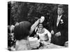 Flower Girl Janet Auchincloss Holding Up a Wedge of Wedding Cake for Bridegroom Sen. John Kennedy-Lisa Larsen-Stretched Canvas