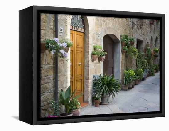 Flower Pots and Potted Plants Decorate a Narrow Street in Tuscan Village, Pienza, Italy-Dennis Flaherty-Framed Stretched Canvas