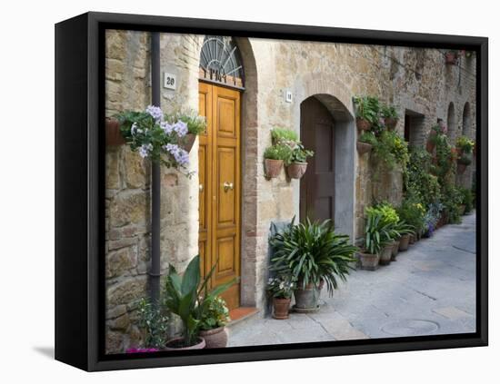 Flower Pots and Potted Plants Decorate a Narrow Street in Tuscan Village, Pienza, Italy-Dennis Flaherty-Framed Stretched Canvas