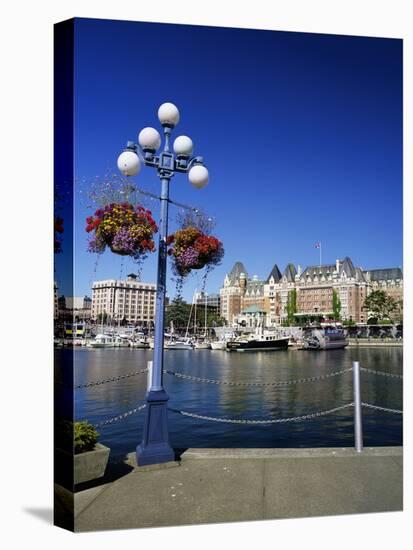 Flower Pots Hanging on Street Light-James Randklev-Stretched Canvas