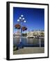 Flower Pots Hanging on Street Light-James Randklev-Framed Photographic Print