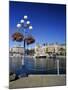 Flower Pots Hanging on Street Light-James Randklev-Mounted Photographic Print