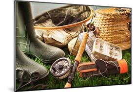 Fly Fishing Equipment on Grass-null-Mounted Art Print