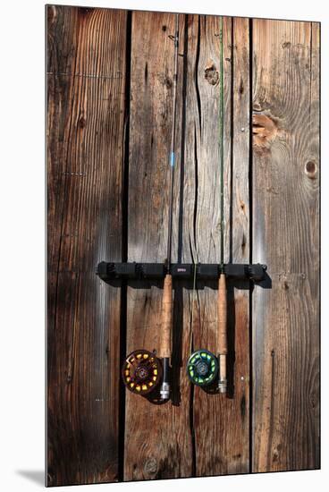 Fly Fishing Rods On The Side Of An Angler's Warming Hut-Ben Herndon-Mounted Premium Photographic Print