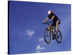 Flying Cyclist-null-Stretched Canvas