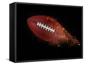 Flying Rugby Ball Isolated on Black.-Kesu01-Framed Stretched Canvas