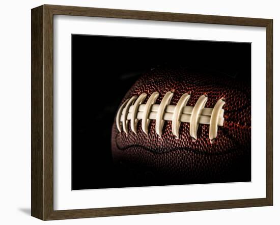 Flying Rugby Ball Isolated on Black.-Kesu01-Framed Photographic Print