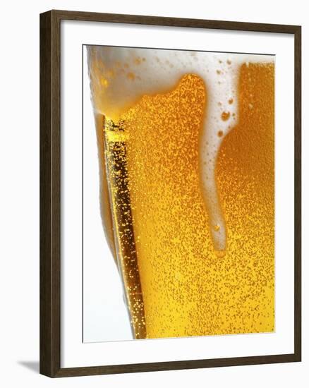 Foam Pouring over Edge of Glass of Light Beer-Brenda Spaude-Framed Photographic Print