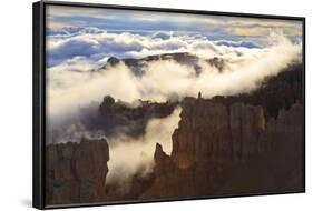 Fog and Clouds of a Partial Temperature Inversion Surround the Red Rocks of Bryce Canyon-Eleanor-Framed Photographic Print