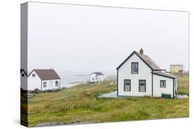 Fog Rolls in over the Small Preserved Fishing Village of Battle Harbour-Michael Nolan-Stretched Canvas