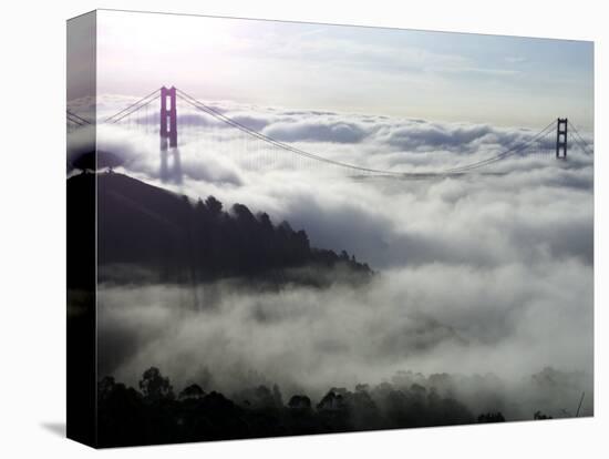 Fog Shrouds the Golden Gate Bridge and the Marin Headlands Near Sausalito-null-Stretched Canvas