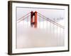 Fog Swirls and Covers All of Golden Gate Bridge Save the North Tower and the Tips of Skyscrapers-null-Framed Photographic Print