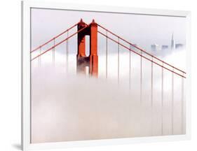 Fog Swirls and Covers All of Golden Gate Bridge Save the North Tower and the Tips of Skyscrapers-null-Framed Photographic Print