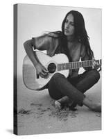 Folk Singer Joan Baez Strumming Her Guitar on the Beach Near Her Home-Ralph Crane-Stretched Canvas