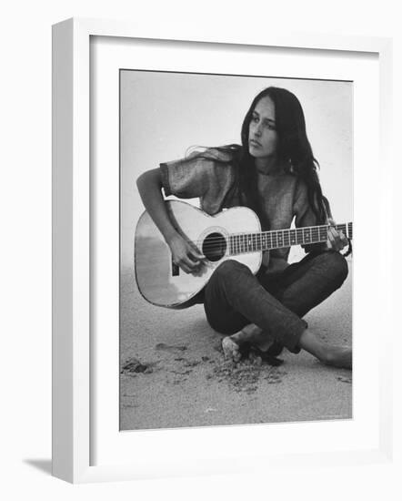 Folk Singer Joan Baez Strumming Her Guitar on the Beach Near Her Home-Ralph Crane-Framed Premium Photographic Print