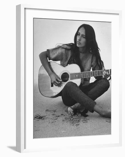 Folk Singer Joan Baez Strumming Her Guitar on the Beach Near Her Home-Ralph Crane-Framed Premium Photographic Print