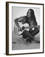 Folk Singer Joan Baez Strumming Her Guitar on the Beach Near Her Home-Ralph Crane-Framed Premium Photographic Print