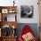 Folk Singer Woody Guthrie Palying His Guitar While Getting a Shoeshine-null-Premium Photographic Print displayed on a wall