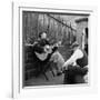 Folk Singer Woody Guthrie Palying His Guitar While Getting a Shoeshine-null-Framed Premium Photographic Print