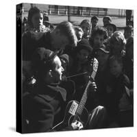 Folk Singer Woody Guthrie Playing Guitar for Group of Children-Eric Schaal-Stretched Canvas