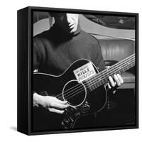 Folk Singer Woody Guthrie Playing Guitar with Sign on It Reading This Machine Kills Fascists-Eric Schaal-Framed Stretched Canvas