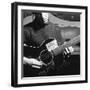 Folk Singer Woody Guthrie Playing Guitar with Sign on It Reading This Machine Kills Fascists-Eric Schaal-Framed Premium Photographic Print