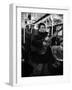 Folk Singer Woody Guthrie Singing Aboard a Subway Train-null-Framed Premium Photographic Print