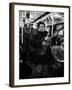 Folk Singer Woody Guthrie Singing Aboard a Subway Train-null-Framed Premium Photographic Print