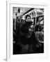 Folk Singer Woody Guthrie Singing Aboard a Subway Train-null-Framed Premium Photographic Print