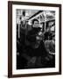 Folk Singer Woody Guthrie Singing Aboard a Subway Train-null-Framed Premium Photographic Print