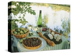 Food and Wine on a Table Beside the River Loire, France-John Miller-Stretched Canvas