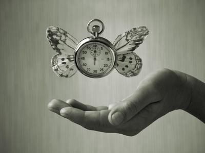 Stopwatch With Butterfly Wings Levitating Above Hand, Black And White, Slight Green Toning
