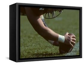 Football Center About to Snap the Ball-Paul Sutton-Framed Stretched Canvas