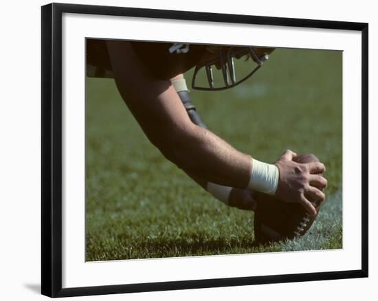 Football Center About to Snap the Ball-Paul Sutton-Framed Photographic Print