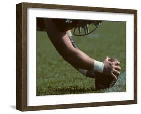 Football Center About to Snap the Ball-Paul Sutton-Framed Photographic Print