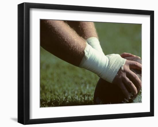 Football Center About to Snap the Ball-Paul Sutton-Framed Photographic Print