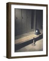 Football Helmet on Bench in Locker Room-null-Framed Photographic Print